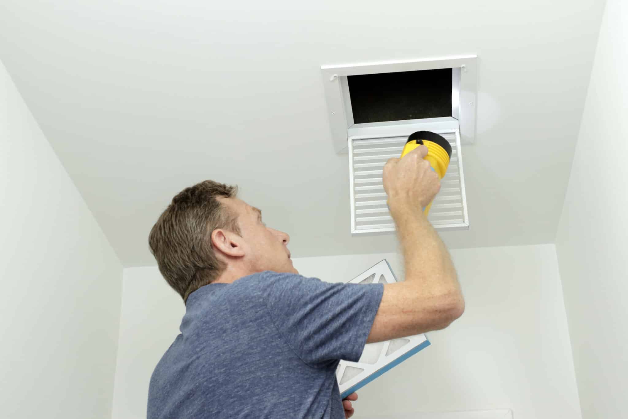 Checking air ducts in home HVAC system, Duct Cleaners Near Me.